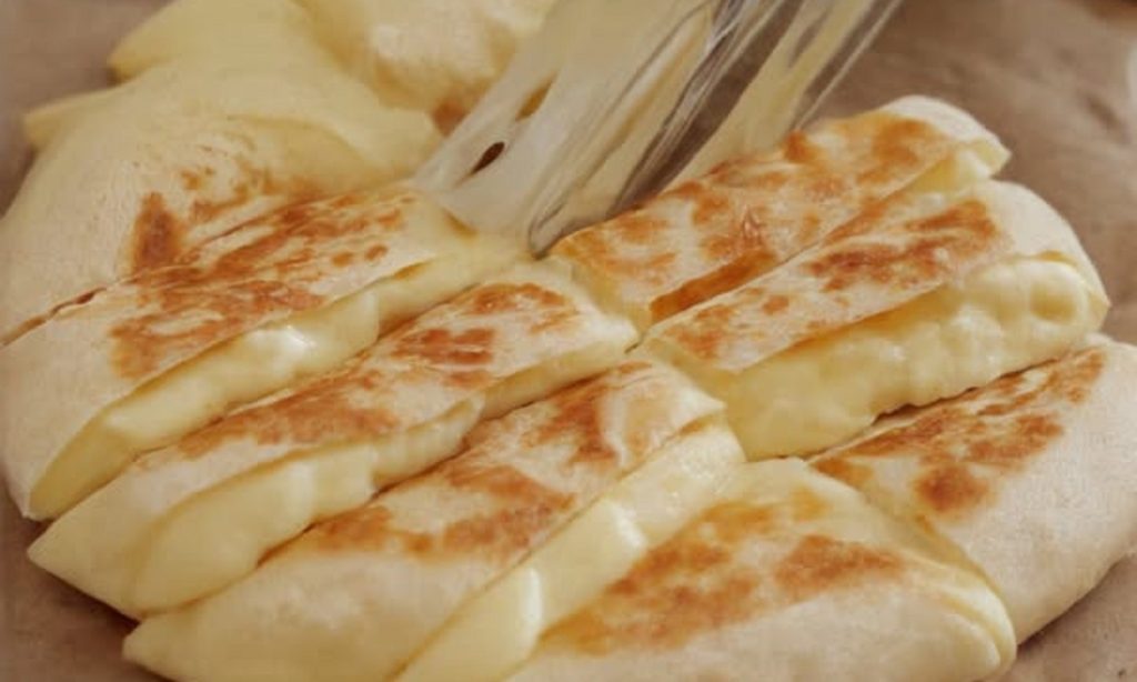 Golden Cheese Potato Bread cooked in a frying pan