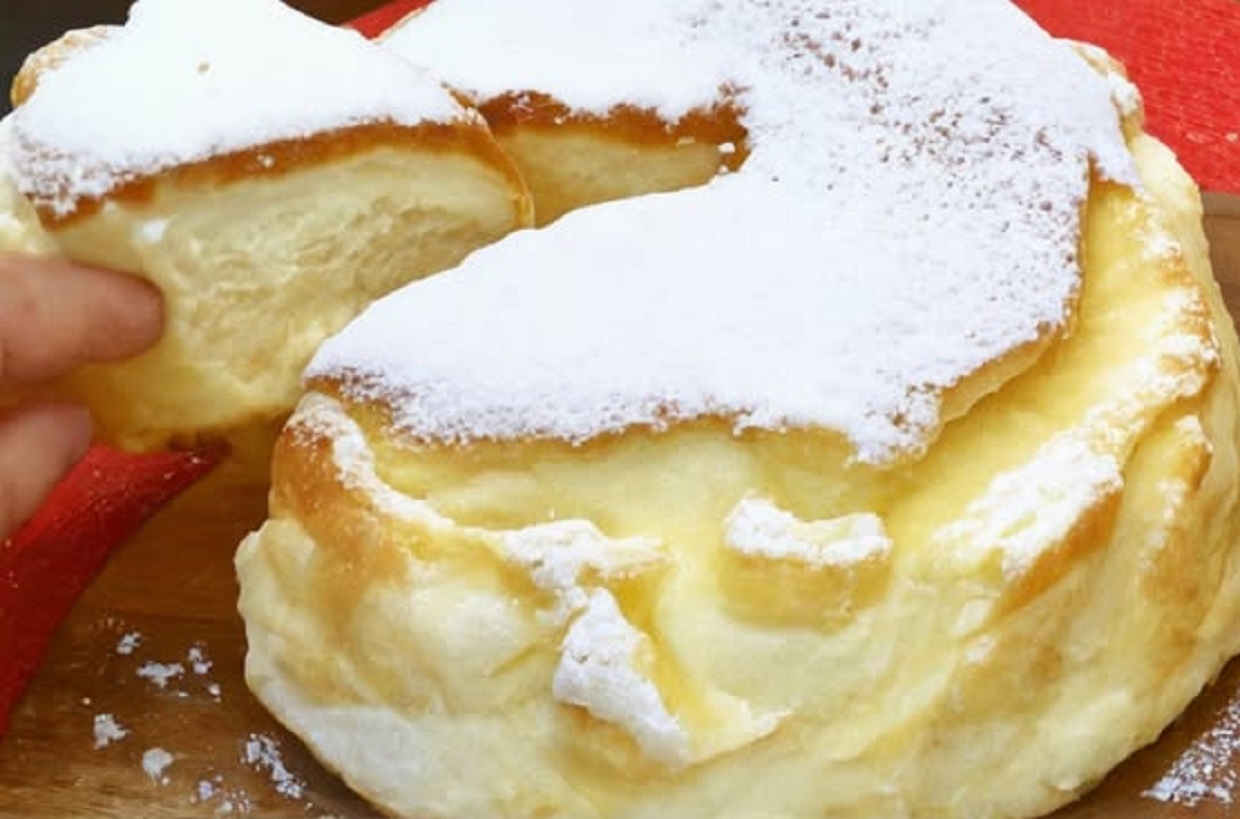 Moist Greek yogurt cake with powdered sugar topping