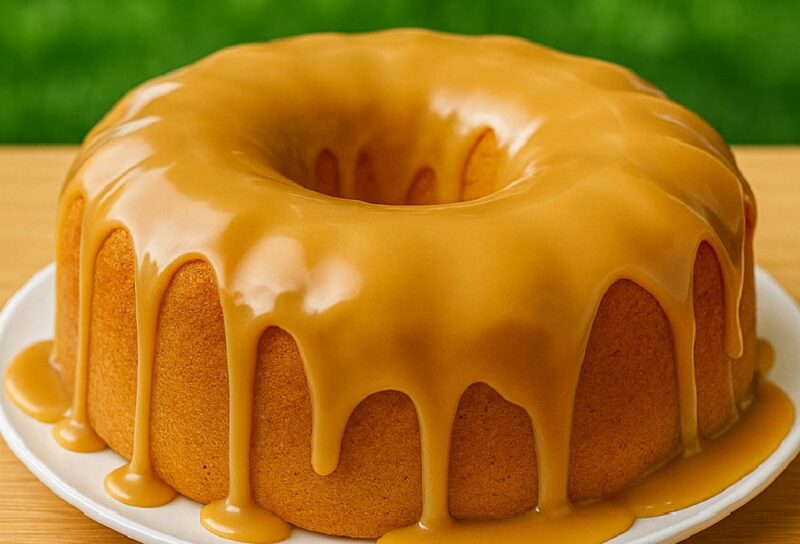 Caramel pound cake with glossy glaze dripping over a golden bundt cake